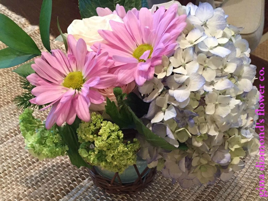A happy arrangement with daisies and hydrangea A happy arrangement of fresh cut flowers
